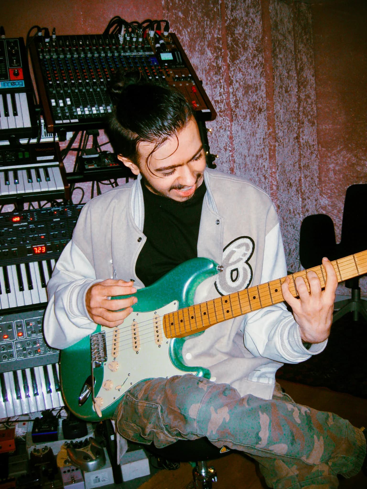 Cadyn Lewis playing guitar at REX Studio, photographed by Leela Rosa