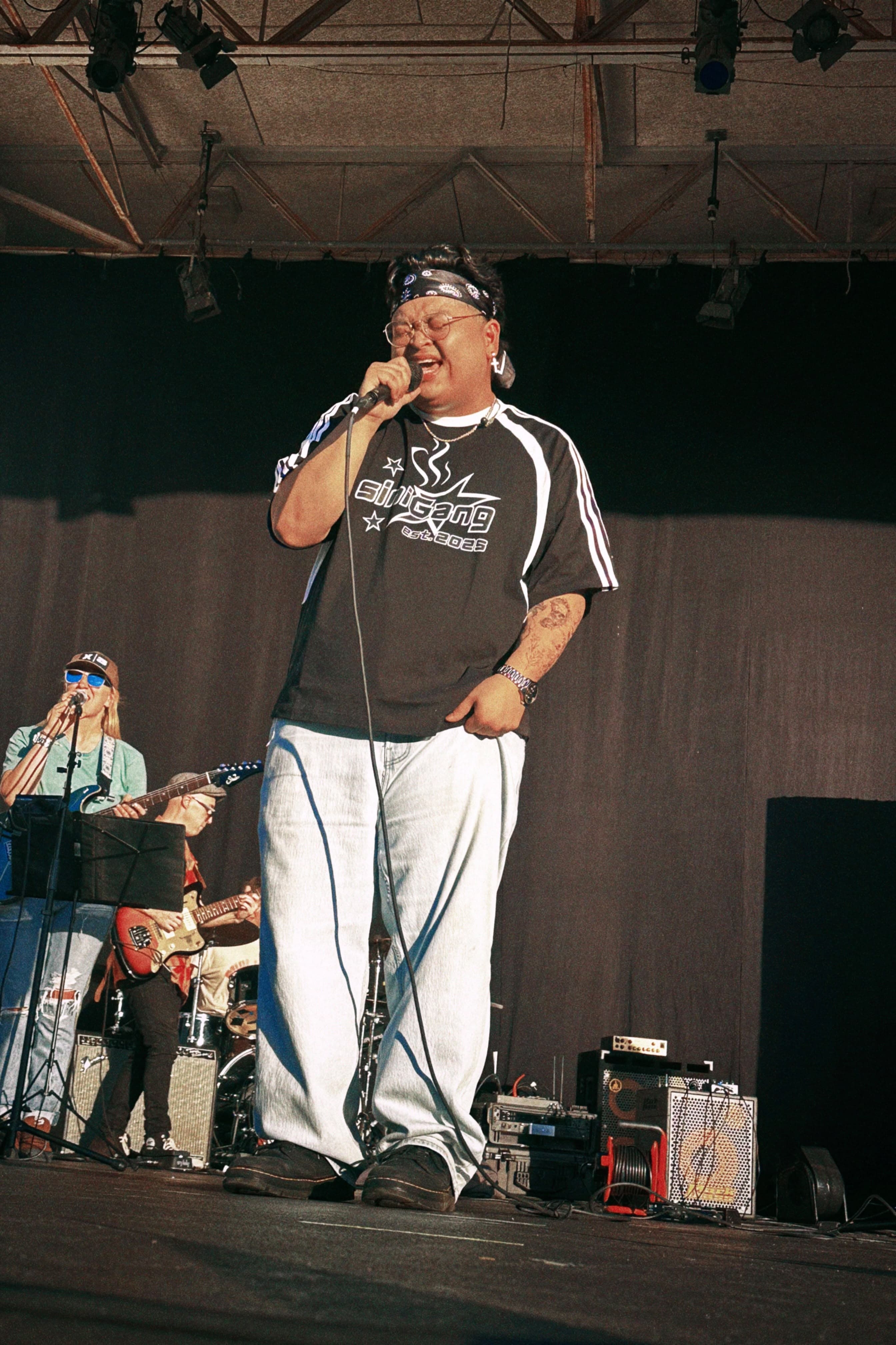 Justin Magnaye singing with his four-piece band at the 2026 Filipino American Festival in New Jersey